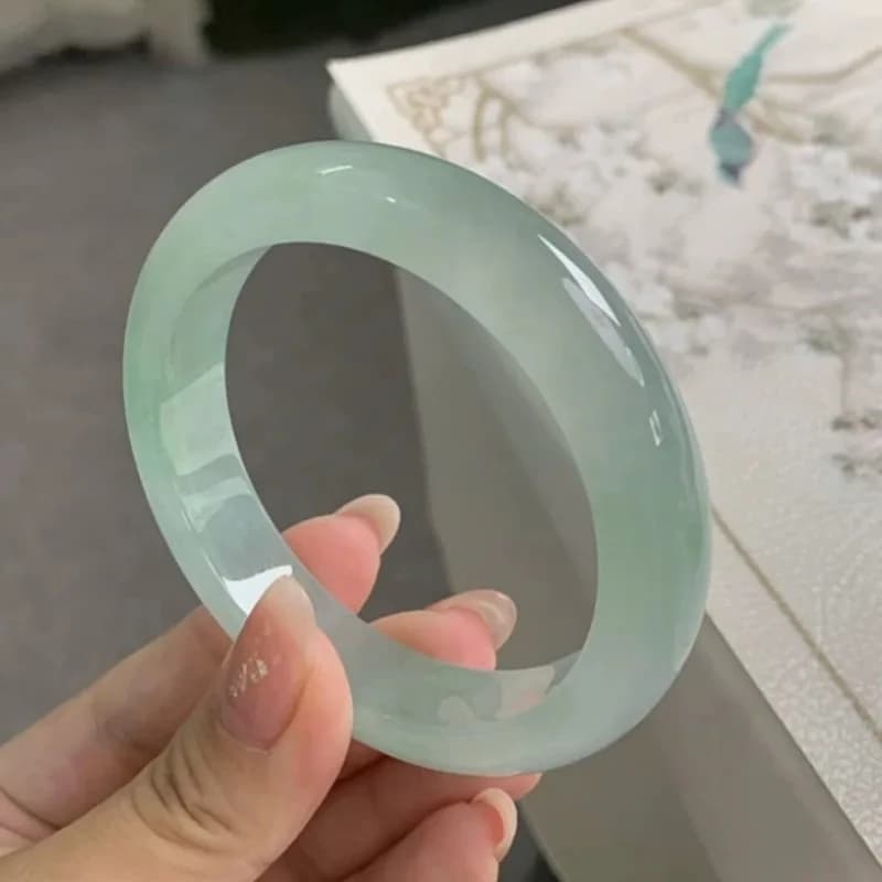 Myanmar Jadeite Sweet Jade Bangle, featuring a patterned design with bright green hues, an ice-like texture, and a tra